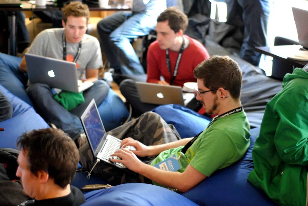 Several students using laptops.