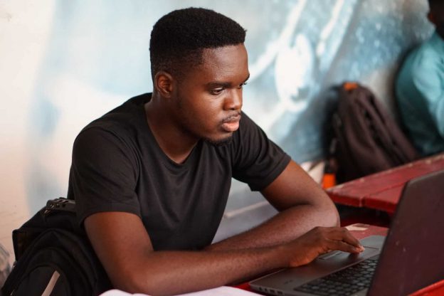 man on laptop trying to connect during an Internet outage