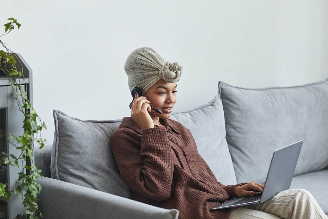 Woman using internet on couch