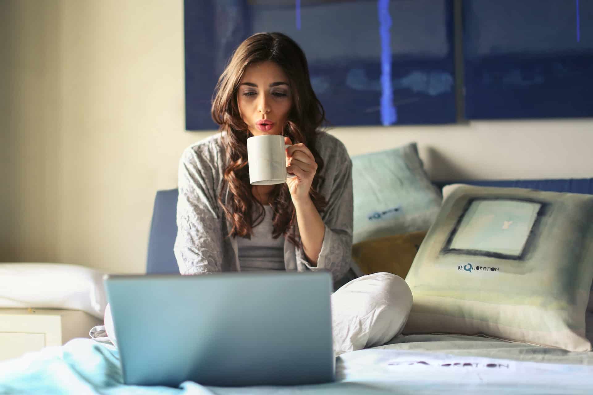A girl on her laptop in bed