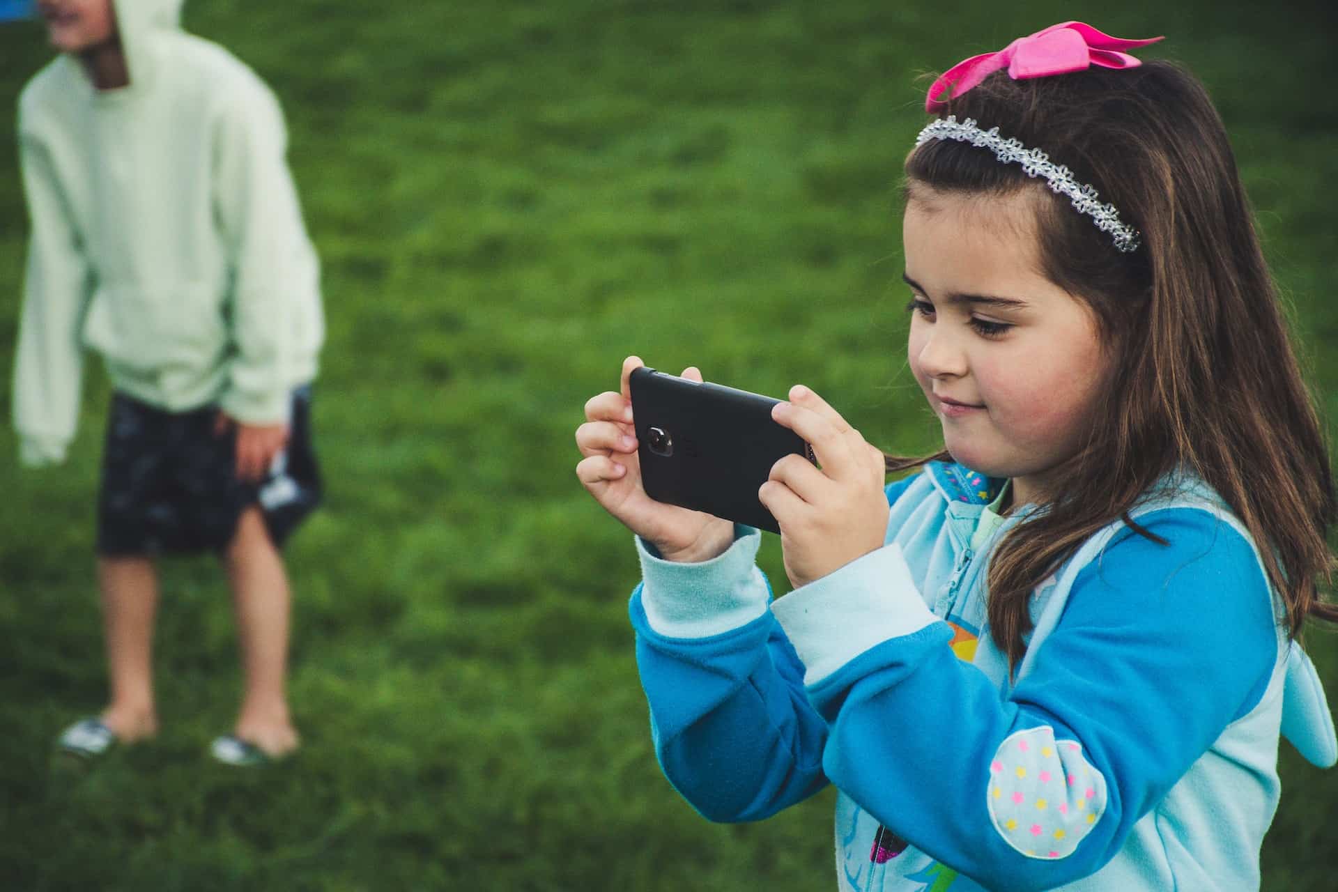 using a smartphone on a sports field