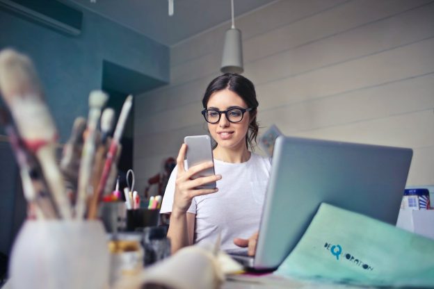 A woman researching what does unlimited data mean using her phone