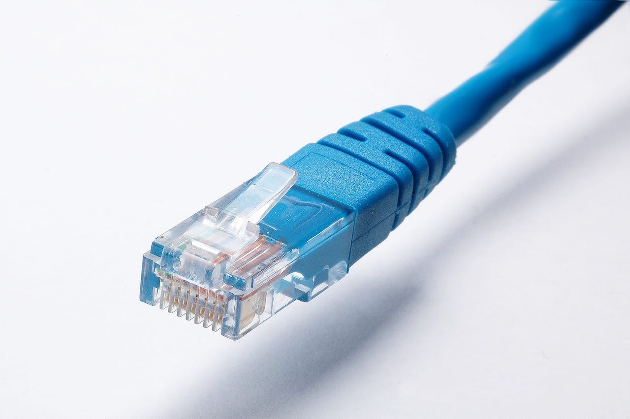 Blue ethernet cable closeup of head prongs