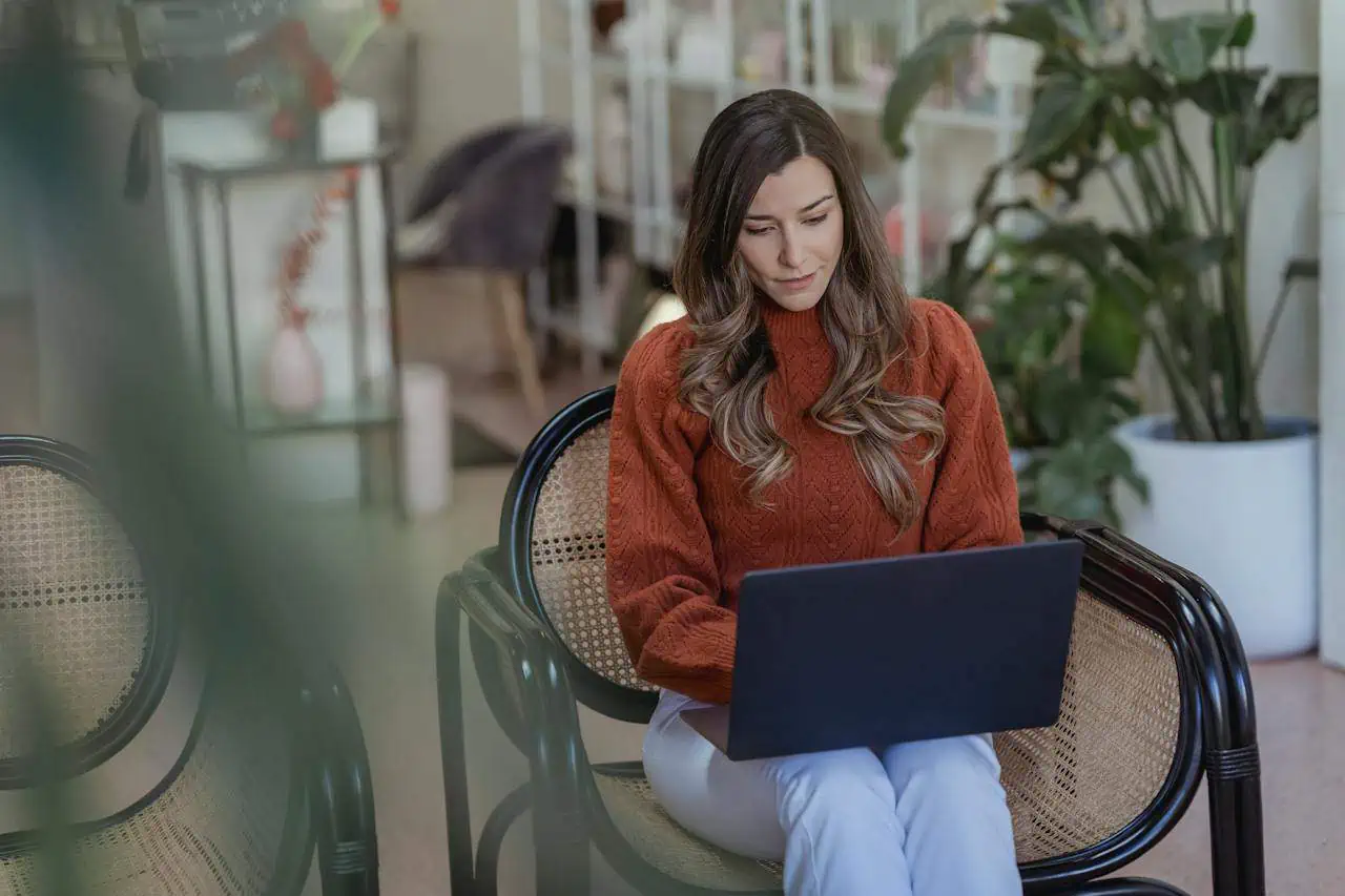 Woman using her laptop in a coffee shop image